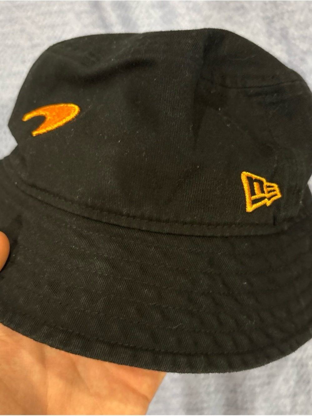 New Era Black Bucket Hat with Orange Embroidered Logos